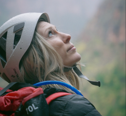 best canyoneering packs 2025 sko gear woman looking up in canyon zions utah behunin