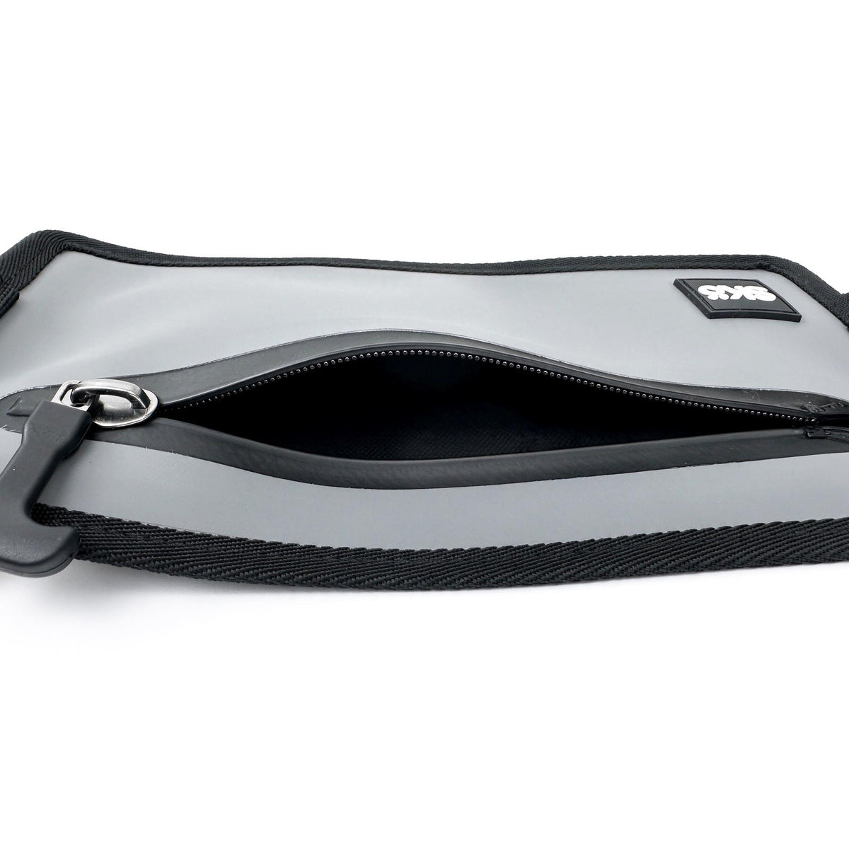Phone Pouch in Stone Gray, close-up of the open zipper showing the dark interior pocket.
