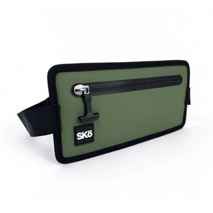 Phone Pouch in Olive Green, three-quarter angle showing the zipper pocket, black woven trim and logo patch.