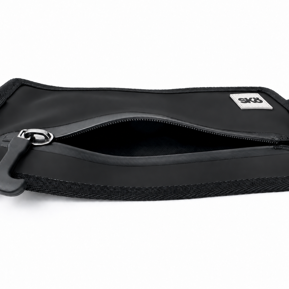 Phone Pouch in Matte Black, top angled view with open zipper, black interior compartment and white square SKÖ logo.