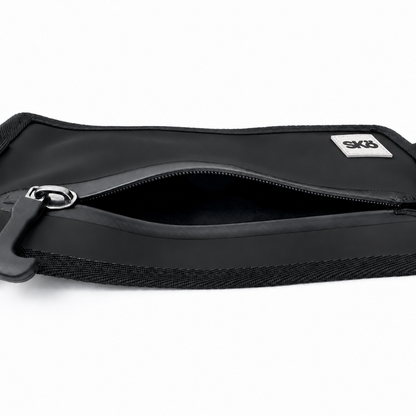 Phone Pouch in Matte Black, top angled view with open zipper, black interior compartment and white square SKÖ logo.